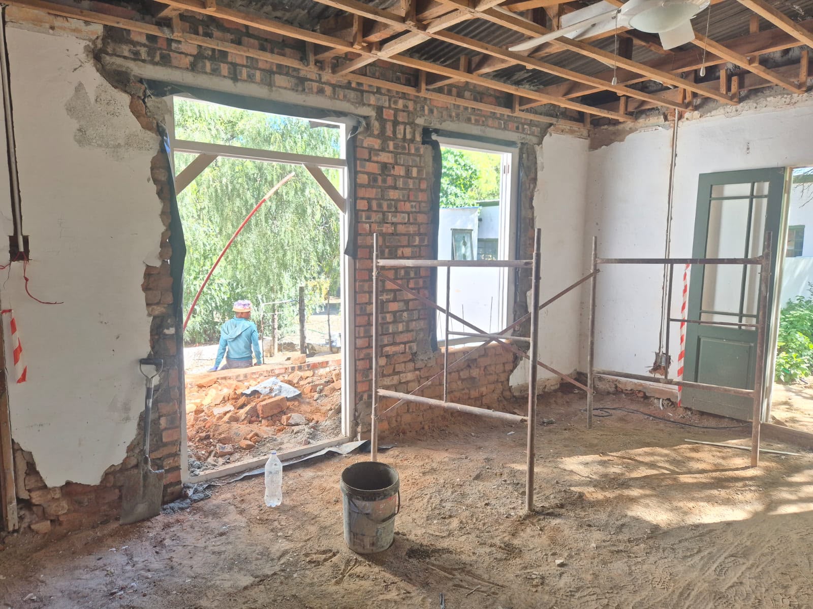 Interior renovation with new window openings and scaffolding